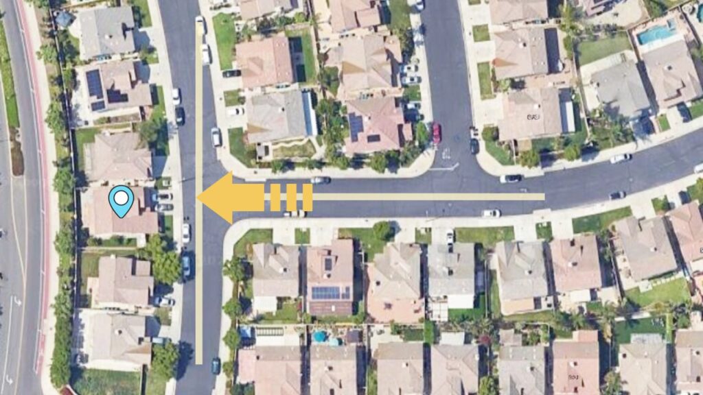 t-junction-house-topview-map Top-down satellite image showing a residential house directly facing a T-shaped road intersection.