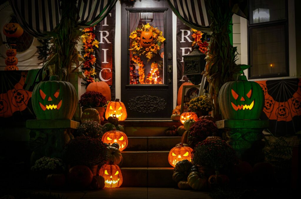 Front porch decorated with glowing jack-o’-lanterns and pumpkins for Halloween Feng Shui
