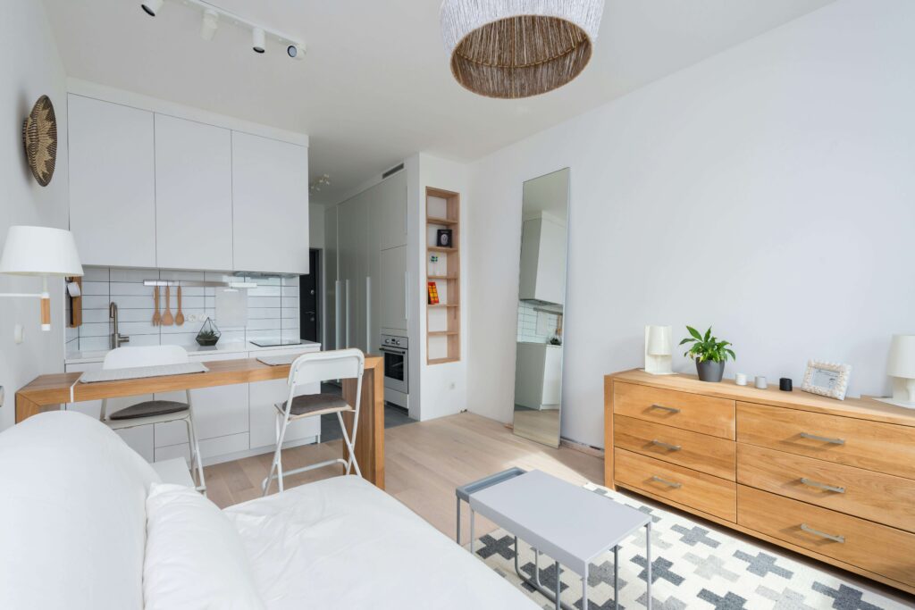 “Modern condo interior with plants, mirror, and natural light, illustrating Feng Shui adjustments for apartments.”