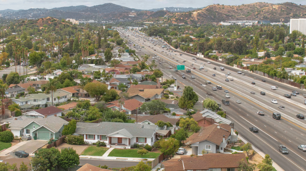Modest American suburban neighborhood located next to a major freeway, showing Feng Shui challenges of noise and pollution.