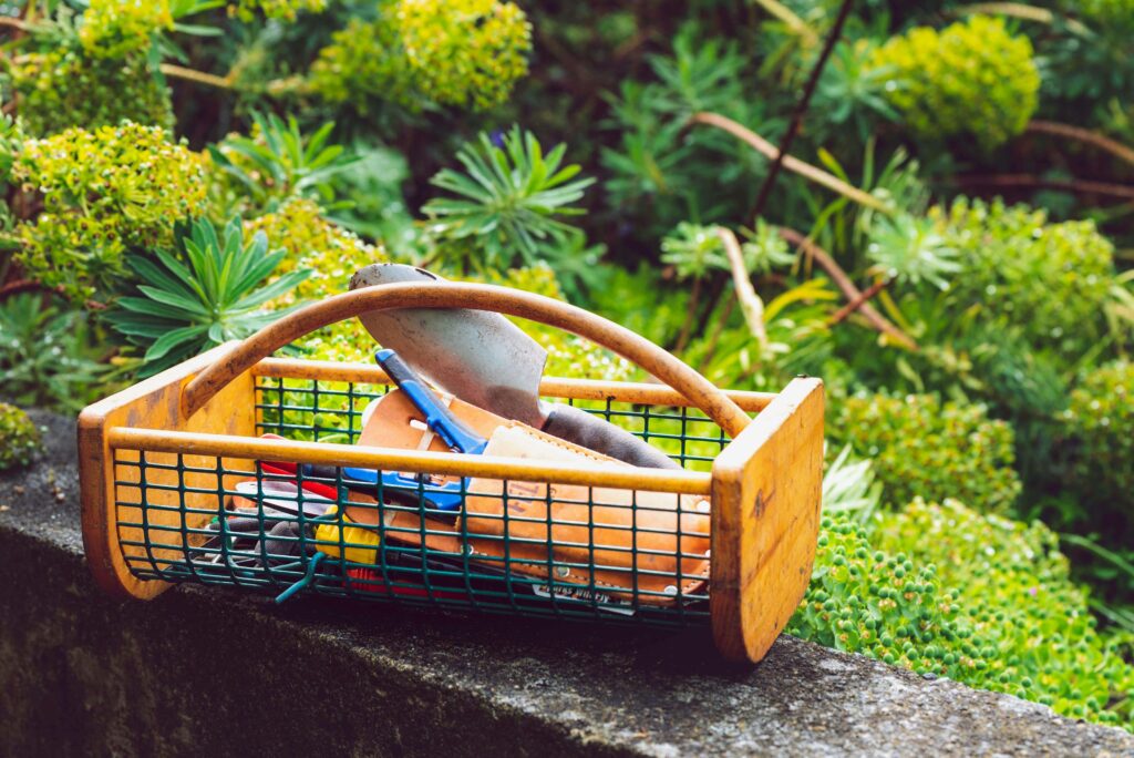 “Basket of gardening tools symbolizing the energy and effort required to maintain a single-family home in Feng Shui.”