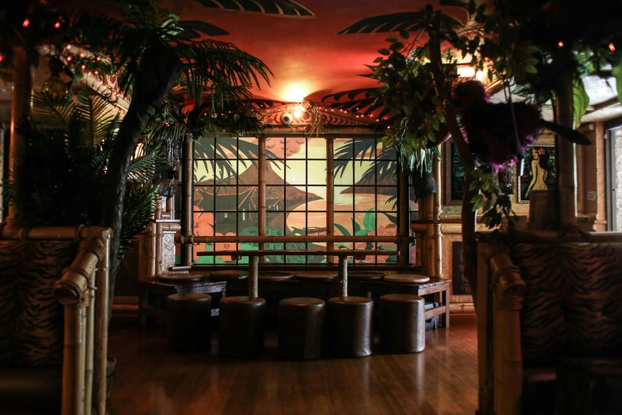 Restaurant dining area with themed decor and round seating arrangement, creating a welcoming atmosphere